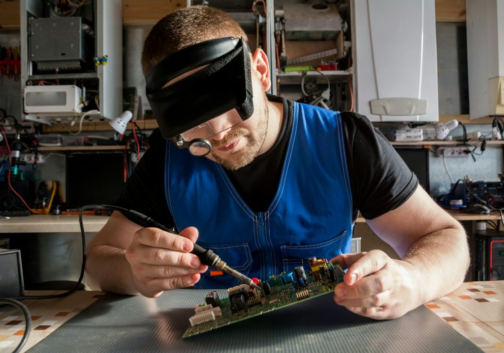 a man working on a circuit board